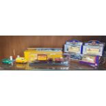 A Shelf of Modern Dinky vehicles, Carters Gallopers truck and Trailor along with 3 boxed models