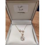 9ct yellow gold ladies necklace with 9ct gold diamond and pearl pendant with matching earrings.