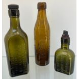 Three antique Gilbert Rae Dunfermline glass bottles- two with stoppers. Two green and one amber
