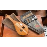 A Selection of musical instruments includes antique zither