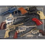 A Collection of mixed vintage childrens cap guns; Lone Star, Lone star Rider, Crescent Rustler Gem