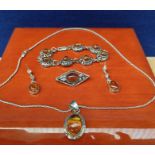 Silver and amber matching jewel set. Pendant, brooch, earrings and bracelet.
