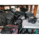 Shelf of camera equipment to include Olympus C-7070 camera, lenses, carry case and accessories