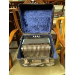 A Hohner Double Ray accordion with case