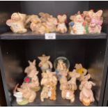 2 Shelves of piggins figures