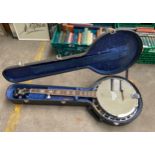 A Countryman Remo banjo with casing