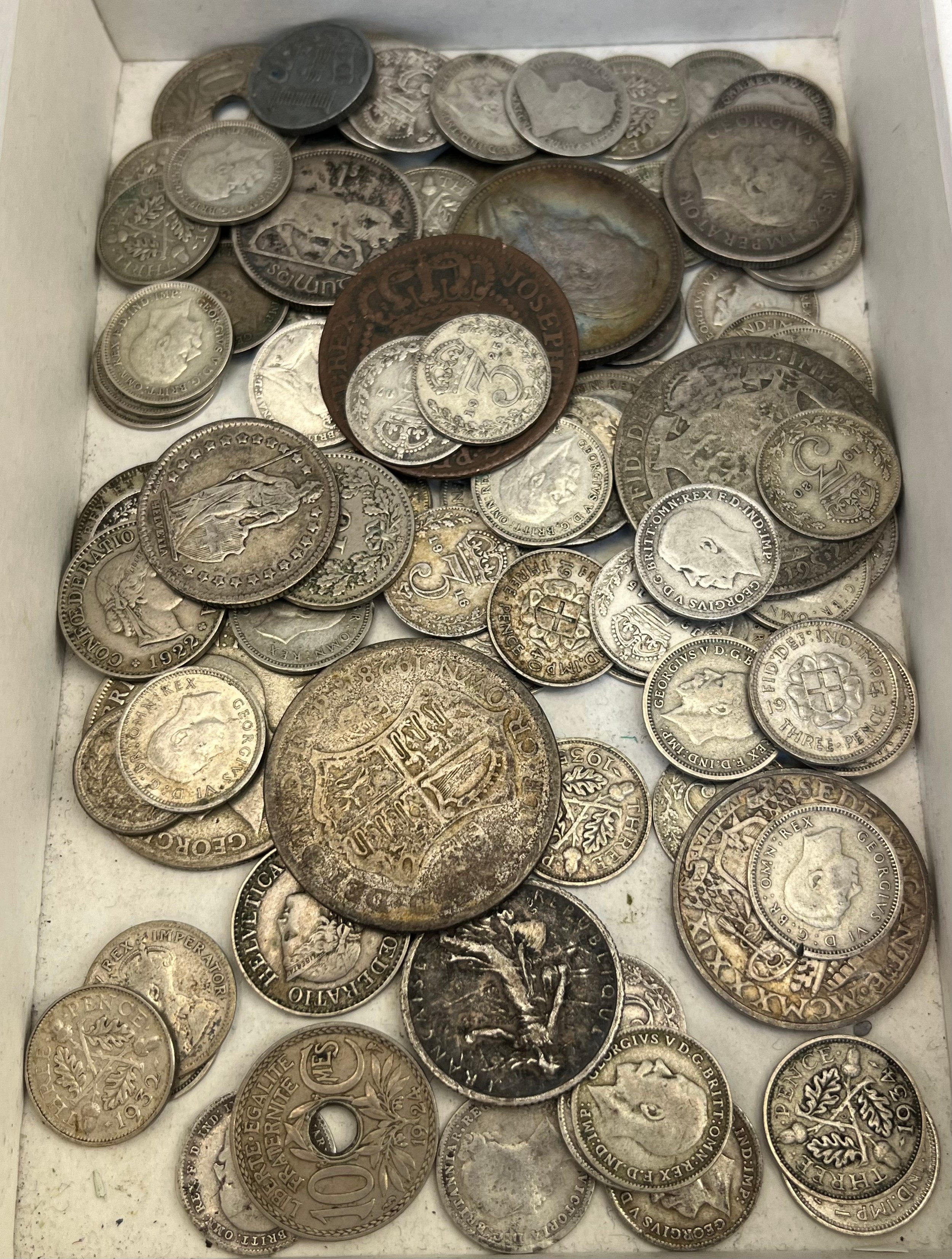 A Collection antique silver coins; includes mostly silver three pence coins.[Silver weight- 229.