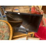A Panasonic flat screen tv with remote (no cables)