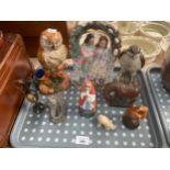 A Tray of collectables includes Staffordshire victorian flat back figures and slip ware style owl