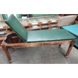 Antique doctors adjustable examination bed, with green leather and nail head trim, supported on a