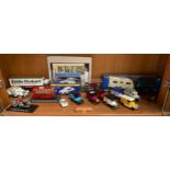 A Shelf of Collectable toys includes advertising vans , Eddie Stobart and many more
