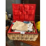 A Wicker weaved sewing box and contents