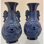 A pair of Chinese Imperial Blue- glazed vases- Qianlong Seal marks of the period. Both depicting