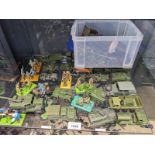 A Shelf of military vehicle models and figures; Britains Ltd Figures, Dinky vehicles and loose