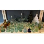 Shelf of antique glass bottles and inkwells; Green bottle- J.S. Stocks- Kincardine, Donkey and