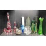 A Shelf of art glass to include Bohemian style decanter and glasses set, jack the pulpit style