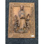 Antique Chinese wooden hand carved raised relief figural panel. Depicts figure holding a pot
