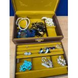 Jewellery box containing various costume jewellery necklaces, earrings and bracelet