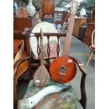 A Selection of musical instruments includes eastern 6 stringed Harp guitar