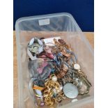 A Plastic tub of mixed costume jewellery to include necklaces, bangles and watches; includes