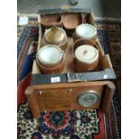 A Box of treen items to include metal bounded biscuit barrels