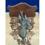 A Black forest wall mounted stag head plaque [needs attention]