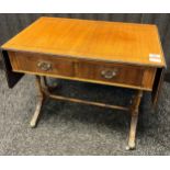 20th century low drop end table, the rectangular top above two short drawers, raised on trestle legs