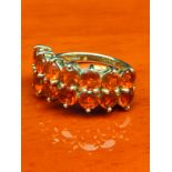 9ct yellow gold ladies ring set with 14 fire opal stones. [Ring size N] [3.34grams]