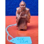 Japanese hand carved root wood netsuke of a samurai figure. Signed to the base. [6cm high]