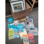 A box of formula one items includes prints, race day comics and others picture one signed by rally