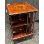 Early 20th century Edwardian revolving bookcase. Ornate inlay to the top section, fitted with
