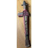 Antique tribal dagger and sheath. Sheath is made up of leather, snakeskin, wire and fur. Dagger-