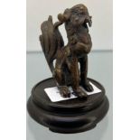 Antique Chinese Bronze sculpture of a seated foo dog- possibly from a censor pot lid. Comes with