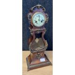 19th century French Mantel clock, styled in a grandfather clock manner. Fitted with brass mounts and