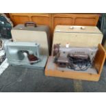 2 Retro Singer sewing machines with cases
