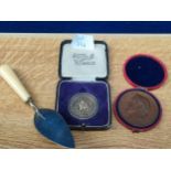 A Selection of boxed medals and plated small Masonic style trowel; Birmingham silver Seed Specialist