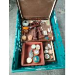 A collection of various pill boxes and collectable wooden carved figures