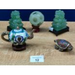 A Selection of oriental collectables includes a pair of jade dog of foo sculptures along with