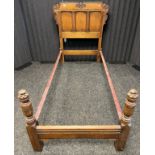 19th century Jacobean style oak single bed frame, fitted with metal sides and pine base insert. [