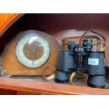 A pair of Greenkat binoculars and mantel clock