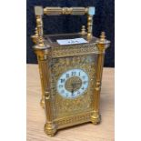 19th century brass carriage clock- double barrel movement. Brass and enamel face. 19cm high.