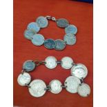 Two silver coin bracelets.