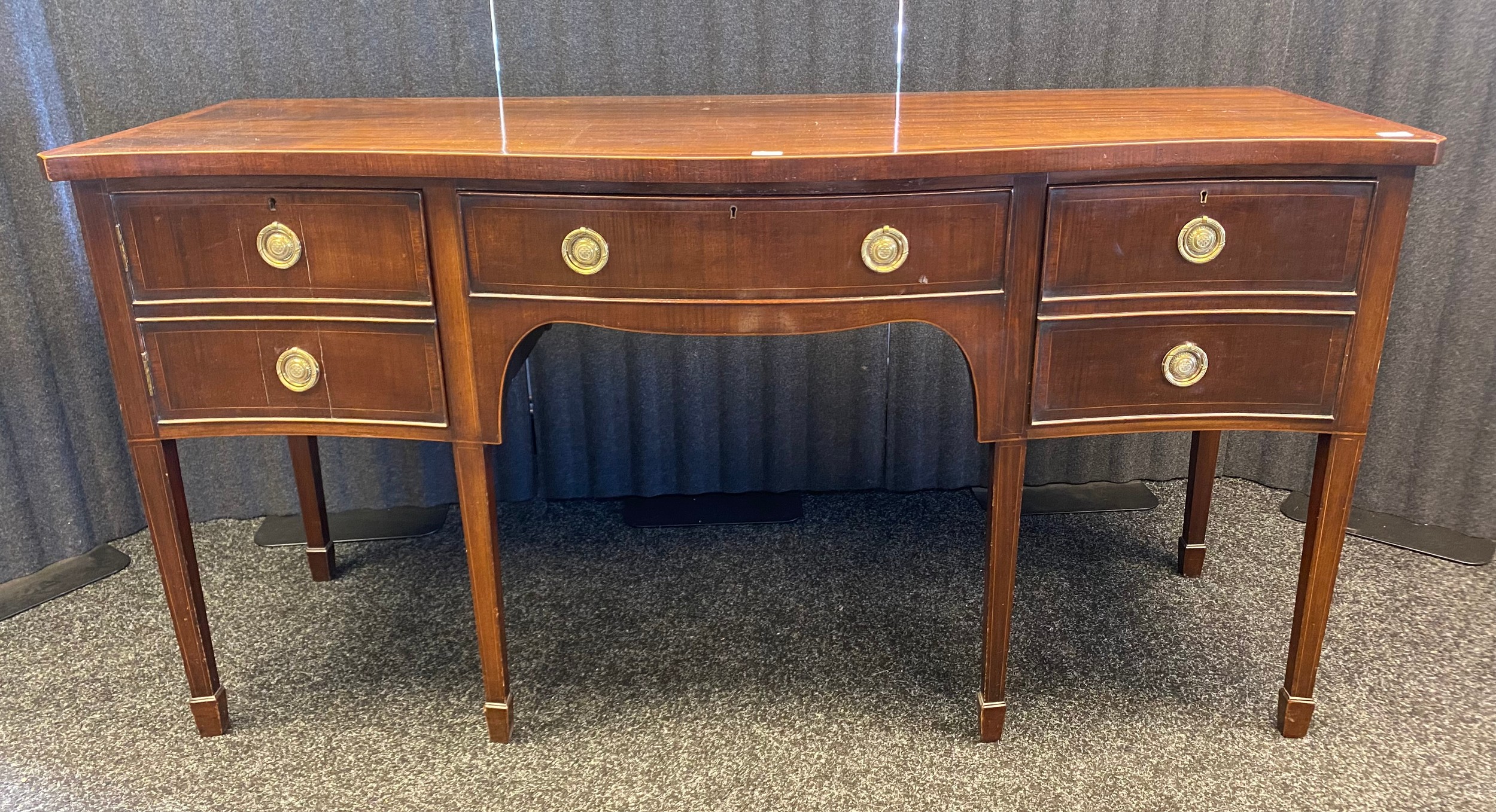 19th century Georgian style, Mahogany serpentine front sideboard- fitted with brass round handles.