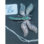 A Silver, Marcasite and Emerald stone dragonfly brooch.