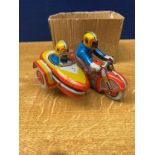 A vintage tin plate clockwork motorcycle and sidecar toy (no key)