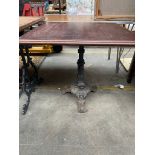 A Cast iron based Bar table with mahogany top
