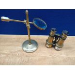 A Vintage Magnifying glass on a brass stand along with set of brass binoculars