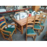 A large oak dining table with 8 chairs