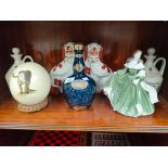 A Shelf of collectables includes Coalport figure Catherine cookson, whisky decanters and others