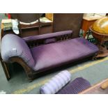 A Victorian chaise longue reupholstered in purple along with display cushions